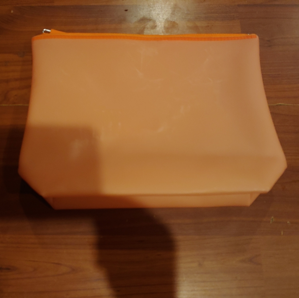 orange rubber like makeup bag